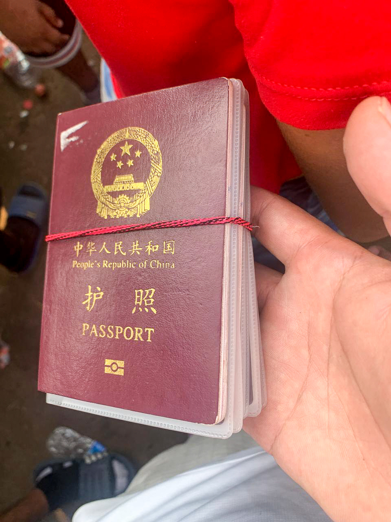 Former automobile manufacturing worker Cheng Jie (the pseudonym) bundled the Chinese passports for himself, his wife and their three children during the journey. (Credit: interviewees)